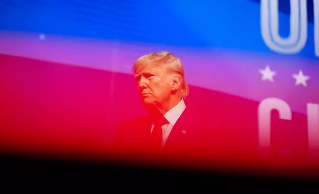 Republican presidential nominee former President Donald Trump stands on stage after speaking during a campaign rally at Thomas &amp; Mack Center, Thursday, Oct. 24, 2024, in Las Vegas. (AP Photo/Alex Brandon)