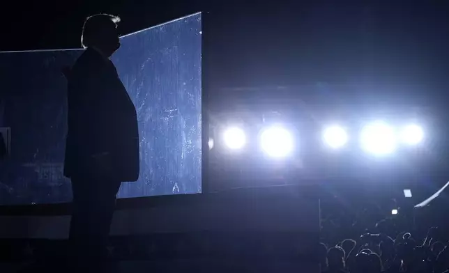 Republican presidential nominee former President Donald Trump listens as Christopher Macchio, not pictured, sings at the conclusion of a campaign event at the Butler Farm Show, Saturday, Oct. 5, 2024, in Butler, Pa. (AP Photo/Alex Brandon)