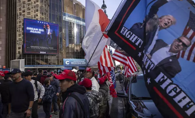 Supporters of Republican presidential nominee former President Donald Trump gather for his campaign rally outside Madison Square Garden, Sunday, Oct. 27, 2024, in New York. (AP Photo/Yuki Iwamura)