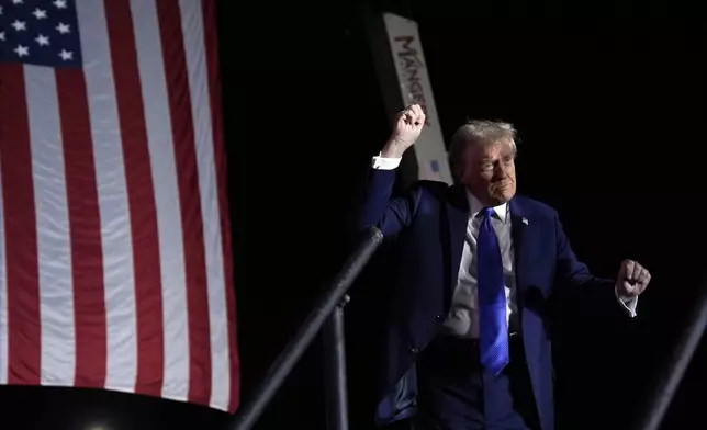 Republican presidential nominee former President Donald Trump dances at a campaign rally at Arnold Palmer Regional Airport, Saturday, Oct. 19, 2024, in Latrobe, Pa. (AP Photo/Evan Vucci)