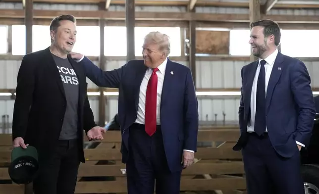 Tesla and SpaceX CEO Elon Musk, from left, Republican presidential nominee former President Donald Trump and Republican vice presidential nominee Sen. JD Vance, R-Ohio, attend a campaign event at the Butler Farm Show, Saturday, Oct. 5, 2024, in Butler, Pa. (AP Photo/Alex Brandon)