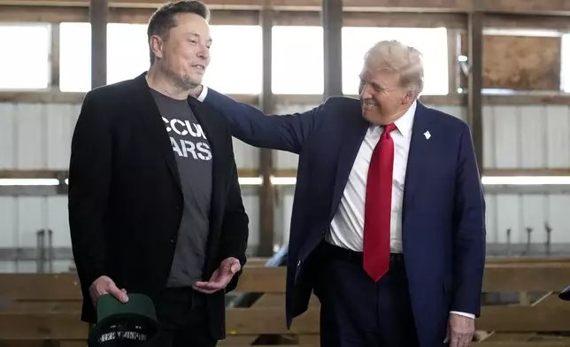 Tesla and SpaceX CEO Elon Musk, left, and Republican presidential nominee former President Donald Trump attend a campaign event at the Butler Farm Show, Saturday, Oct. 5, 2024, in Butler, Pa. (AP Photo/Alex Brandon)