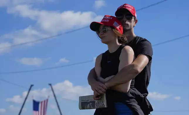 Megan and Ian Meier arrive before Republican presidential nominee former President Donald Trump speaks at a campaign rally at the Butler Farm Show, Saturday, Oct. 5, 2024, in Butler, Pa. (AP Photo/Julia Demaree Nikhinson)