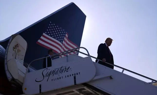 Republican presidential nominee former President Donald Trump arrives at Detroit Metropolitan Wayne County Airport, Friday, Oct. 18, 2024, in Detroit. (AP Photo/Evan Vucci)