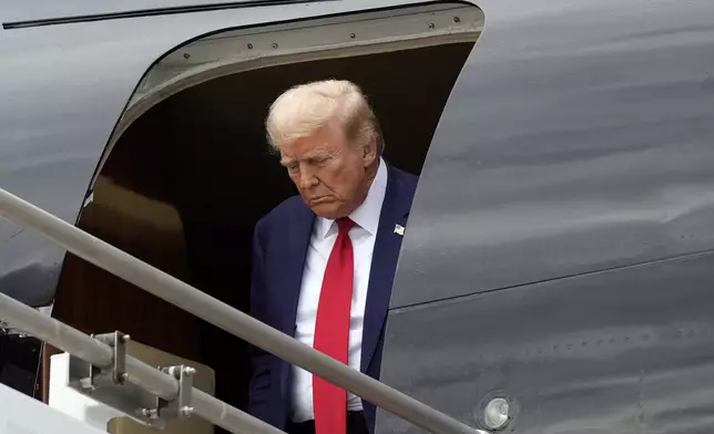 Republican presidential nominee former President Donald Trump arrives at Augusta Regional Airport to visit areas impacted by Hurricane Helene, Friday, Oct. 4, 2024, in Augusta, Ga. (AP Photo/Evan Vucci)