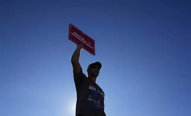 A supporter arrives before Republican presidential nominee former President Donald Trump speaks at a campaign rally, Saturday, Oct. 19, 2024, at Arnold Palmer Regional Airport in Latrobe, Pa. (AP Photo/Matt Rourke)