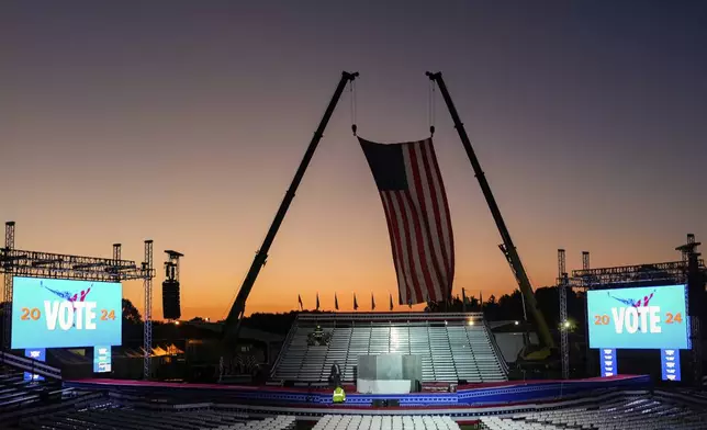 The campaign rally site is seen near sunrise before Republican presidential nominee former President Donald Trump speaks at the Butler Farm Show, Saturday, Oct. 5, 2024, in Butler, Pa. (AP Photo/Julia Demaree Nikhinson)