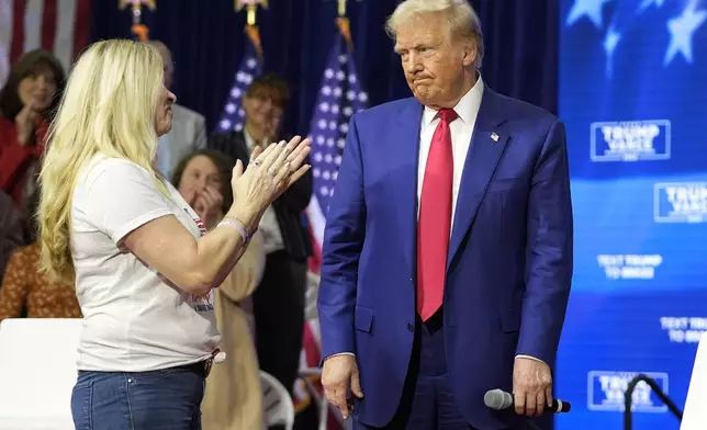 Republican presidential nominee former President Donald Trump greets people as he arrives at a campaign town hall at the Greater Philadelphia Expo Center &amp; Fairgrounds, Monday, Oct. 14, 2024, in Oaks, Pa. (AP Photo/Alex Brandon)