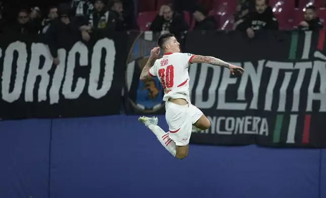 Leipzig's Benjamin Sesko celebrates after he scored during the UEFA Champions League opening phase soccer match between Leipzig and Juventus in Leipzig, Germany, Wednesday, Oct. 2, 2024.(AP Photo/Ebrahim Noroozi)