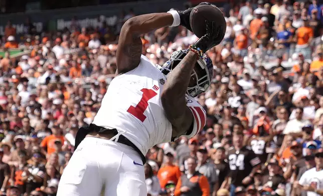 New York Giants wide receiver Malik Nabers (1) catches a touchdown pass against the Cleveland Browns during the first half of an NFL football game, Sunday, Sept. 22, 2024 in Cleveland. (AP Photo/Sue Ogrocki)