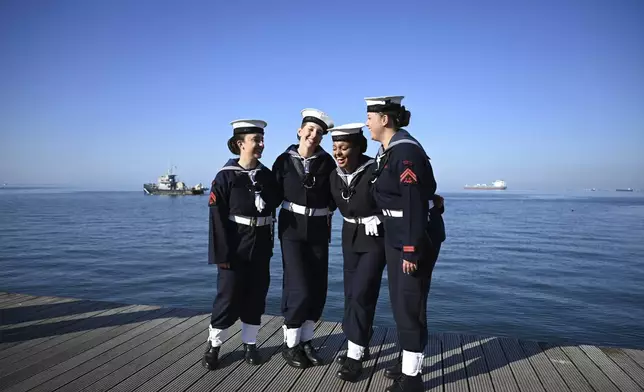 Students of the Hellenic Naval Academy pose for a photograph before the military parade to celebrate the country's entry into World War II after it refused to align itself with a belligerent fascist Italy in 1940, in Thessaloniki, northern Greece, Monday, Oct. 28, 2024. (AP Photo/Giannis Papanikos)