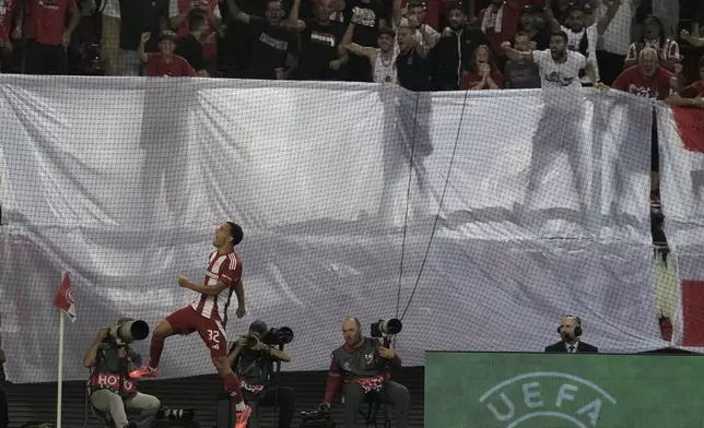 Olympiacos' Santiago Hezze celebrates after scoring his side's second goal during the Europa League opening phase soccer match between Olympiacos and SC Braga at the Georgios Karaiskakis stadium at Athens' port of Piraeus, Greece, Thursday, Oct. 3, 2024. (AP Photo/Thanassis Stavrakis)