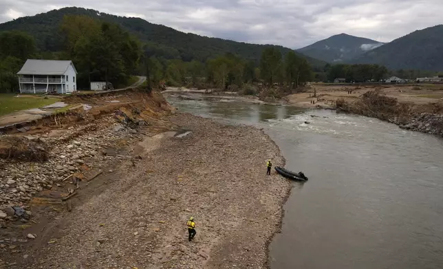 Personnel from Urban Search and Rescue Utah Task Force 1 search for victims of the Impact Plastics tragedy in the aftermath of Hurricane Helene Friday, Oct. 4, 2024, in Erwin, Tenn. (AP Photo/Jeff Roberson)