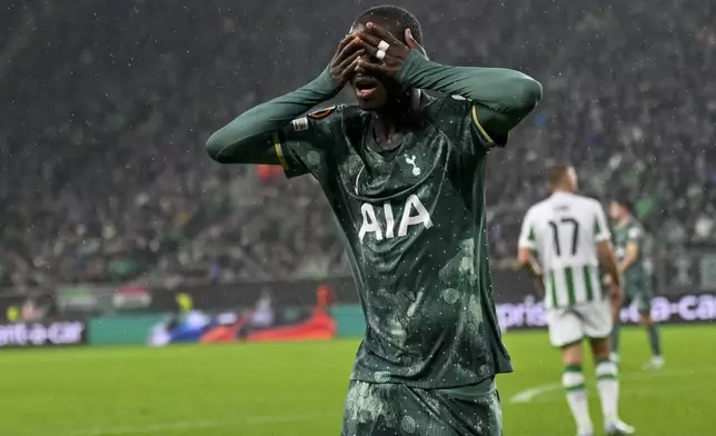 Tottenham's Pape Matar Sarr celebrates after scoring his side's opening goal during the Europa League soccer match between Ferencvaros and Tottenham Hotspur in Budapest, Hungary, Thursday, Oct. 3, 2024. (AP Photo/Denes Erdos)