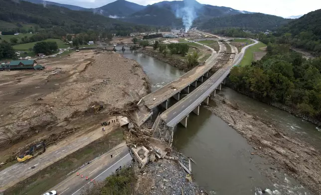 A bridge along Interstate 26 is destroyed in the aftermath of Hurricane Helene Friday, Oct. 4, 2024, in Erwin, Tenn. (AP Photo/Jeff Roberson)