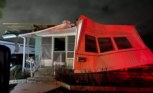 A damaged mobile home stands in Harbor Lights Club, a mobile home park, on Long Bayou in St. Petersburg, Fla. after Hurricane Milton, Thursday, Oct. 10, 2024. (Tampa Bay Times via AP)