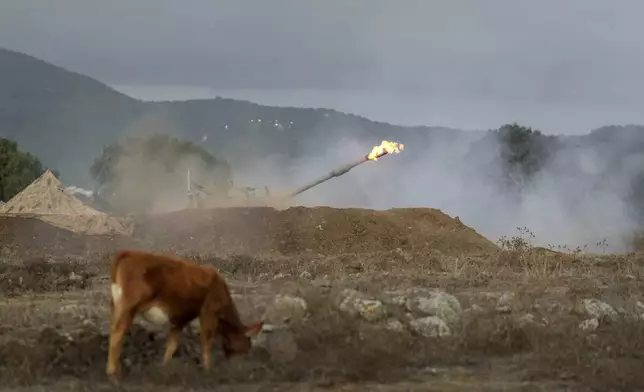 An Israeli mobile artillery unit fires a shell from northern Israel towards Lebanon, Wednesday, Oct. 2, 2024. (AP Photo/Baz Ratner)