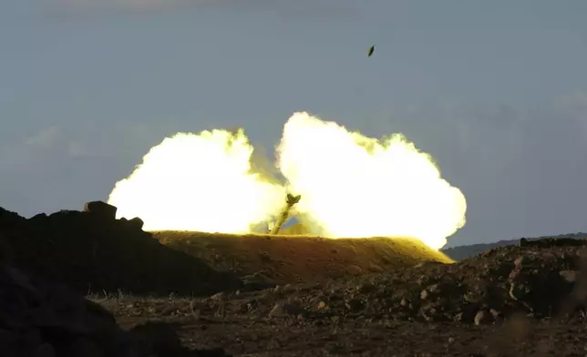 An Israeli mobile artillery unit fires a shell from northern Israel towards Lebanon, Wednesday, Oct. 2, 2024. (AP Photo/Baz Ratner)