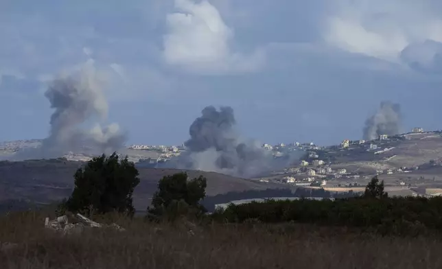 Smoke rises following Israeli bombardment in southern Lebanon as seen from northern Israel, Wednesday, Oct. 2, 2024. (AP Photo/Baz Ratner)