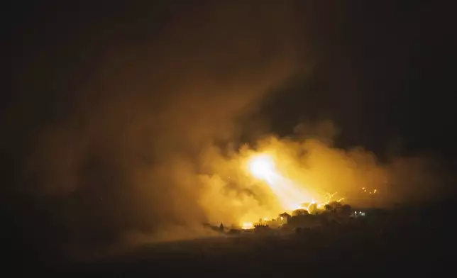 Israeli shelling hits an area in southern Lebanon as seen from northern Israel, early Tuesday, Oct. 1, 2024. (AP Photo/Leo Correa)