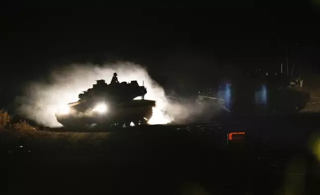 An Israeli tank manoeuvres in northern Israel near the Israel-Lebanon border, Monday, Sept. 30, 2024. (AP Photo/Baz Ratner)