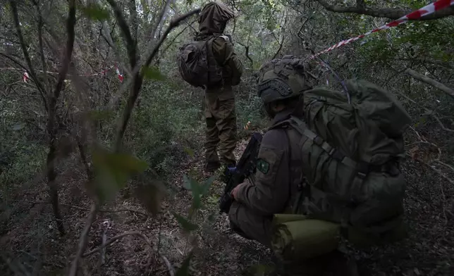 Israeli soldiers are seen during a ground operation in southern Lebanon, near the border with Israel, Sunday, Oct. 13, 2024. (AP Photo/Sam McNeil)