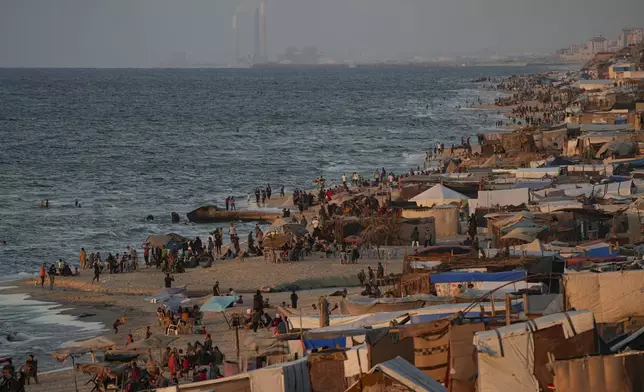 Tents are crammed together as displaced Palestinians camp along the beach of Deir al-Balah, central Gaza Strip, Wednesday, Oct. 9, 2024. (AP Photo/Abdel Kareem Hana)