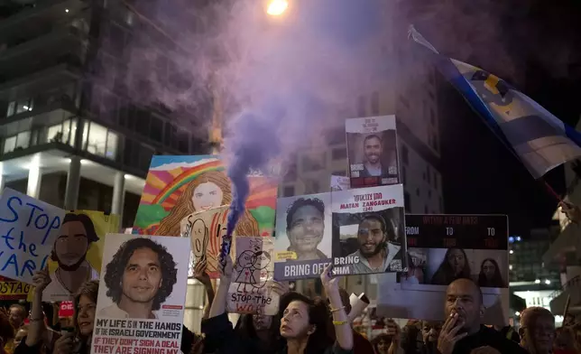 Relatives of Israelis held hostage by Hamas in the Gaza Strip and their supporters protest outside the hotel where U.S. Secretary of State Antony Blinken is staying during a visit with Israeli leadership in Tel Aviv, Tuesday, Oct. 22, 2024. (AP Photo/Maya Alleruzzo)