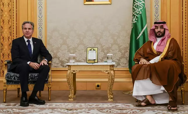 U.S. Secretary of State Antony Blinken, left, meets Saudi Crown Prince Mohammed bin Salman in Riyadh, Saudi Arabia, Wednesday Oct. 23, 2024. (Nathan Howard/Pool via AP)