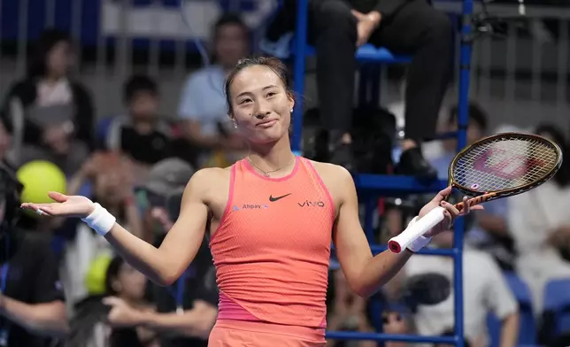 China's Zheng Qinwen gestures after winning against Sofia Kenin of the United States in the final match of the Pan Pacific Open women's tennis tournament at Ariake Coliseum, in Tokyo, Sunday, Oct. 27, 2024. (AP Photo/Eugene Hoshiko)