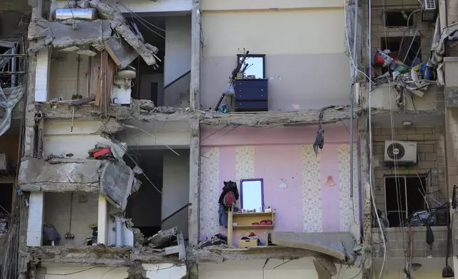 Damaged furnitures left on destroyed apartments that were hit by Israeli airstrikes, in Tyre, south Lebanon, Thursday, Oct. 24, 2024. (AP Photo/Mohammed Zaatari)