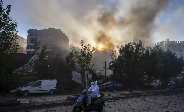 Smoke rises from the site of an Israeli airstrike in Dahiyeh, Beirut, Lebanon, Thursday, Oct. 3, 2024. (AP Photo/Hassan Ammar)