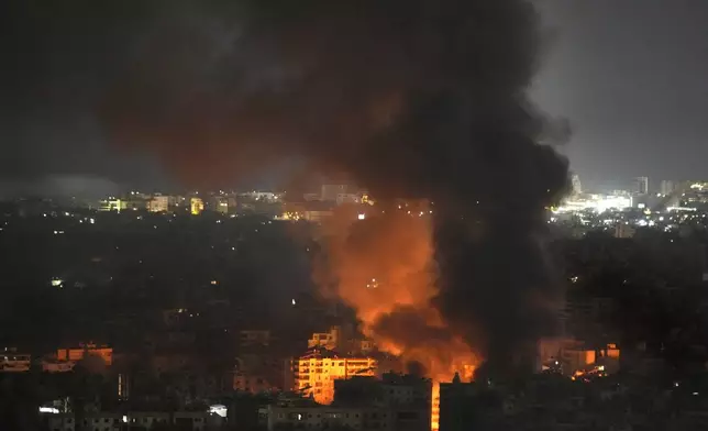 Flame and smoke rises from an Israeli airstrike on Dahiyeh, in the southern suburb of Beirut, Lebanon, early Sunday, Oct. 27, 2024. (AP Photo/Hussein Malla)