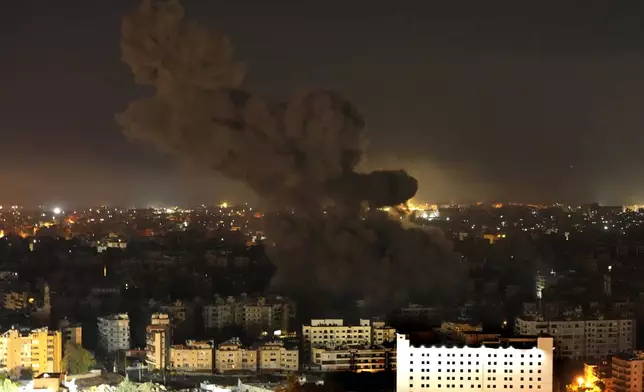 Smoke rises from an Israeli airstrike in Dahiyeh, Beirut, Lebanon, Tuesday, Oct. 8, 2024. (AP Photo/Hassan Ammar)