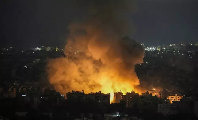 Flames and smoke rise from an Israeli airstrike in Dahiyeh, Beirut, Lebanon, Sunday, Oct. 6, 2024. (AP Photo/Bilal Hussein)