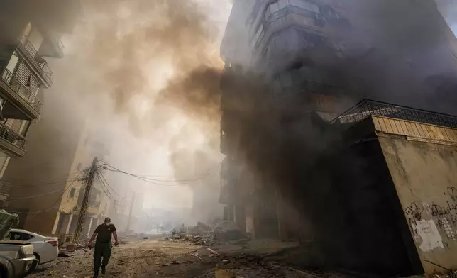 Smoke rises from the site of an Israeli airstrike in Dahiyeh, Beirut, Lebanon, Wednesday, Oct. 2, 2024. (AP Photo/Hassan Ammar)