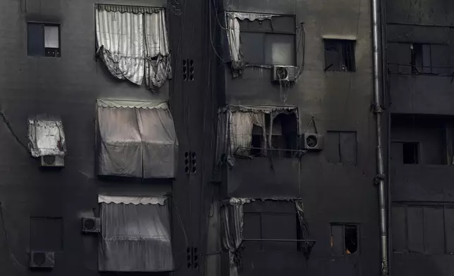 A burnt building shows damage at the site of an Israeli airstrike in Beirut's southern suburb, Lebanon, Tuesday, Oct. 1, 2024. (AP Photo/Hassan Ammar)