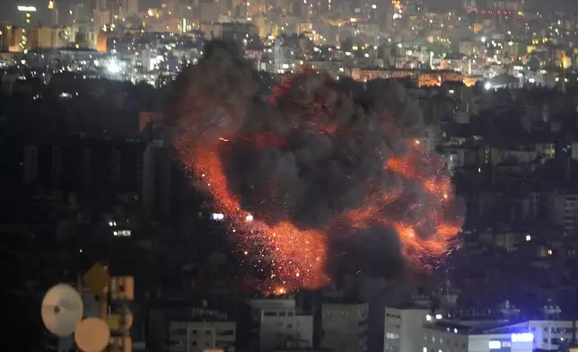 Flame and smoke rises from an Israeli airstrike on Dahiyeh, in the southern suburb of Beirut, Lebanon, early Sunday, Oct. 27, 2024. (AP Photo/Hussein Malla)