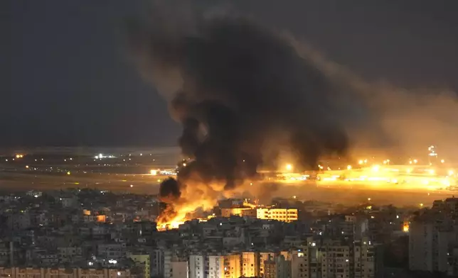 Flames and smoke rise form an Israeli airstrike on Dahiyeh, in the southern suburb of Beirut, Lebanon, Sunday, Oct. 20, 2024. (AP Photo/Hussein Malla)