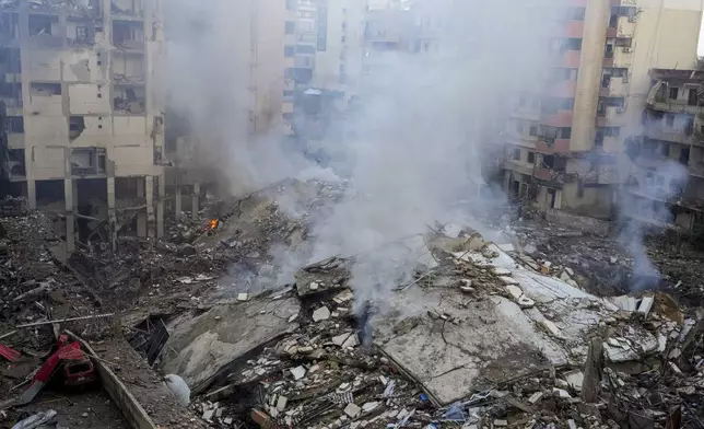 Smoke rises from the site of an Israeli airstrike in Beirut's southern suburb, Lebanon, Tuesday, Oct. 1, 2024. (AP Photo/Hassan Ammar)