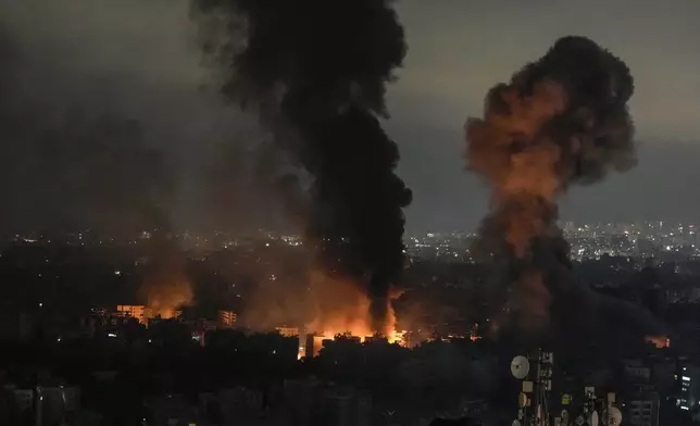 Flames and smoke rise from an Israeli airstrike in Dahiyeh, Beirut, Lebanon, early Monday, Oct. 7, 2024. (AP Photo/Bilal Hussein)