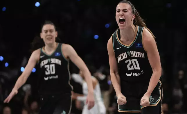 New York Liberty guard Sabrina Ionescu (20) reacts after scoring against the Minnesota Lynx during the third quarter of Game 5 of the WNBA basketball final series, Sunday, Oct. 20, 2024, in New York. (AP Photo/Pamela Smith)