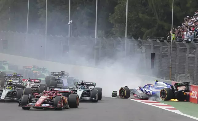 RB driver Yuki Tsunoda of Japan crashes during the Formula One Mexico Grand Prix auto race at the Hermanos Rodriguez racetrack in Mexico City, Sunday, Oct. 27, 2024. (AP Photo/Fernando Llano)