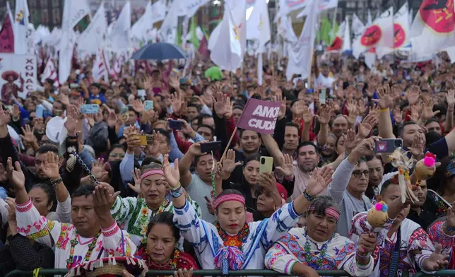 Supporters of President Claudia Sheinbaum attend a rally in the Zócalo, Mexico City's main square, on her inauguration day, Tuesday, Oct. 1, 2024. (AP Photo/Eduardo Verdugo)