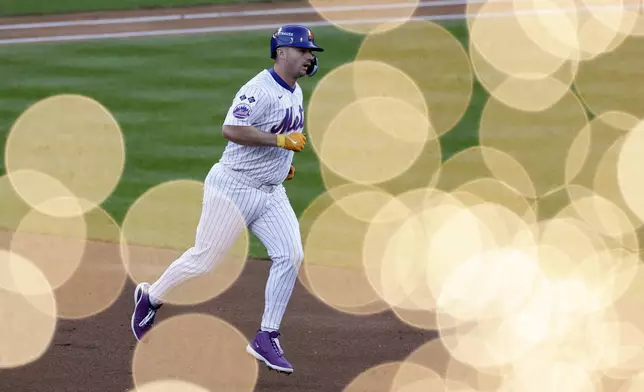 New York Mets' Pete Alonso celebrates a three-run home run against the Los Angeles Dodgers during the first inning in Game 5 of a baseball NL Championship Series, Friday, Oct. 18, 2024, in New York. (AP Photo/Adam Hunger)