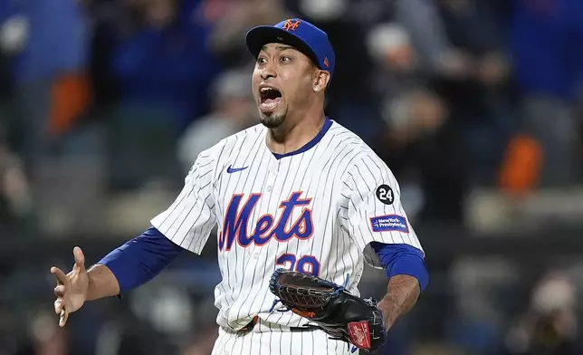 New York Mets pitcher Edwin Díaz (39) reacts after striking out the Philadelphia Phillies to end Game 4 of the National League baseball playoff series, Wednesday, Oct. 9, 2024, in New York. (AP Photo/Frank Franklin II)