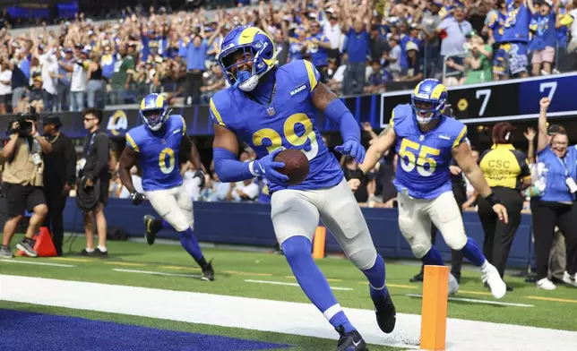 Los Angeles Rams safety Jaylen McCollough (39) celebrates his touchdown during the first half of an NFL football game against the Green Bay Packers Sunday, Oct. 6, 2024, in Inglewood, Calif. (AP Photo/Ryan Sun)