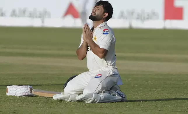 Pakistan's Kamran Ghulam celebrates after scoring century during the first day of the second test cricket match between Pakistan and England, in Multan, Pakistan, Tuesday, Oct. 15, 2024. (AP Photo/K.M. Chaudary)