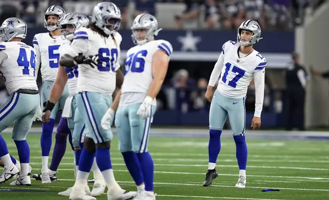 Dallas Cowboys' Brandon Aubrey (17) and the rest of the line watch Aubrey's 65-yard field goal go through the uprights in the first half of an NFL football game against the Baltimore Ravens in Arlington, Texas, Sunday, Sept. 22, 2024. (AP Photo/Jeffrey McWhorter)