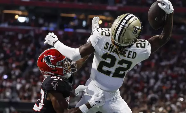 Atlanta Falcons cornerback Dee Alford (20) breaks up a pass intended for New Orleans Saints wide receiver Rashid Shaheed (22) during the second half of an NFL football game, Sunday, Sept. 29, 2024, in Atlanta. (AP Photo/Butch Dill)